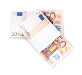 Photo of Bundles of 50 Euro banknotes on white background, top view. Money exchange