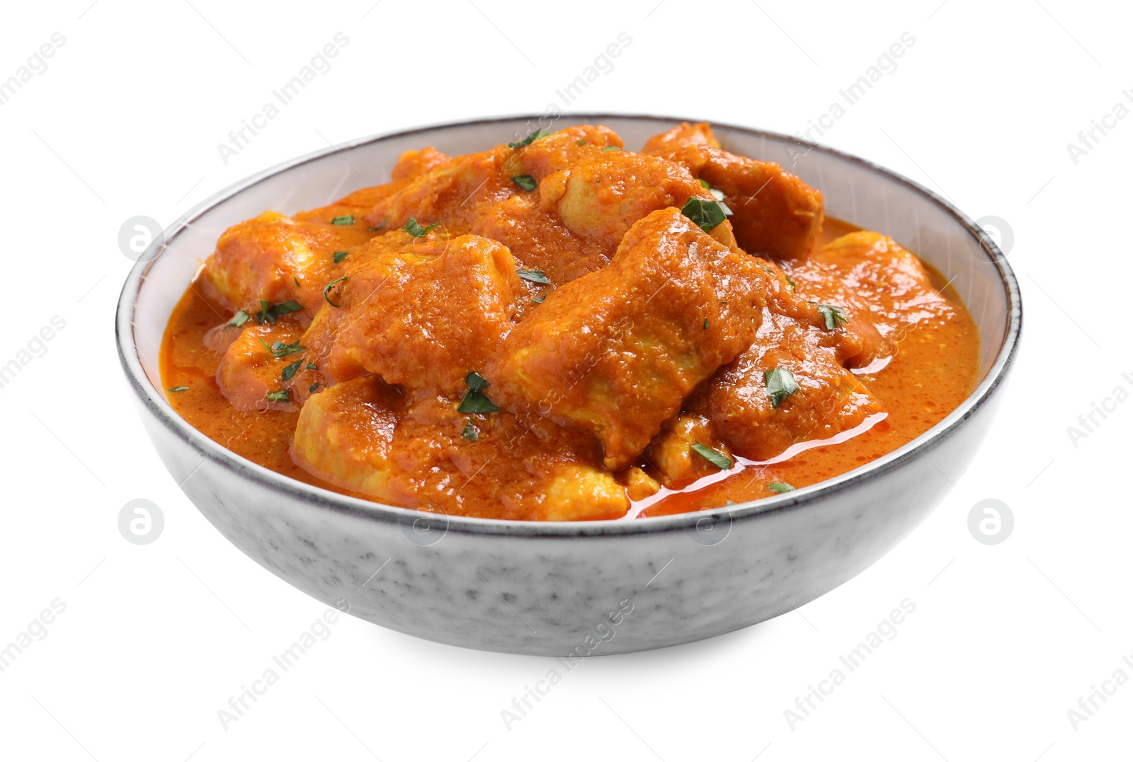 Photo of Bowl of delicious chicken curry on white background