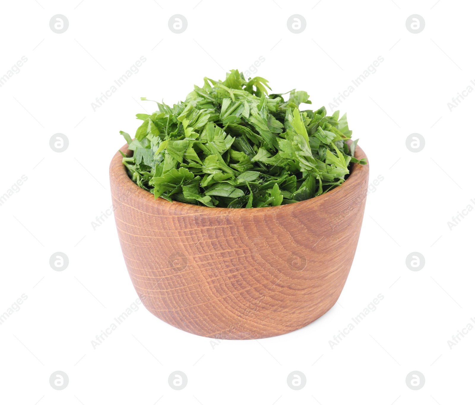 Chopped parsley leaves in wooden bowl isolated on white Photo of Chopped parsley leaves in wooden bowl isolated on white
