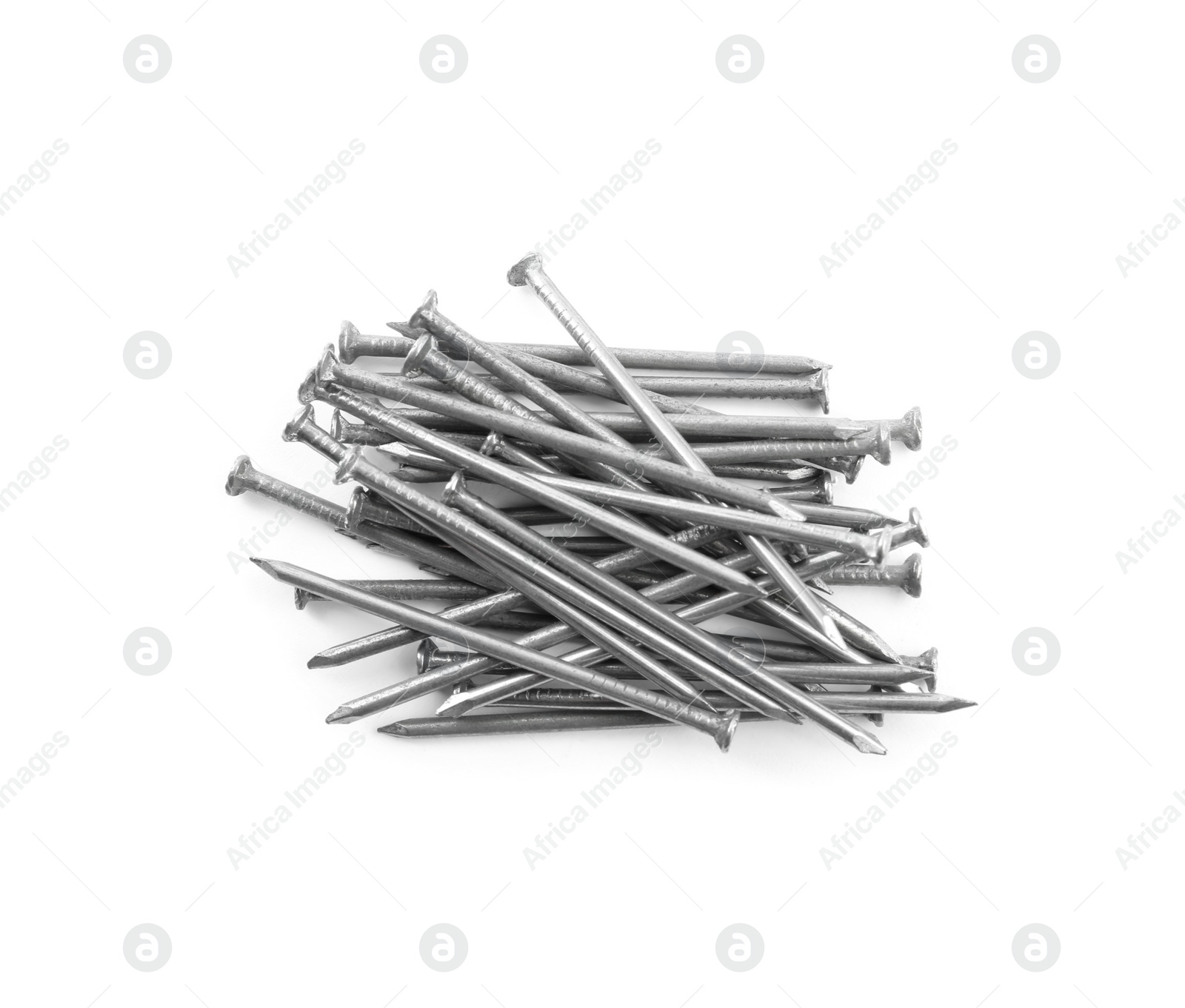 Photo of Pile of metal nails on white background