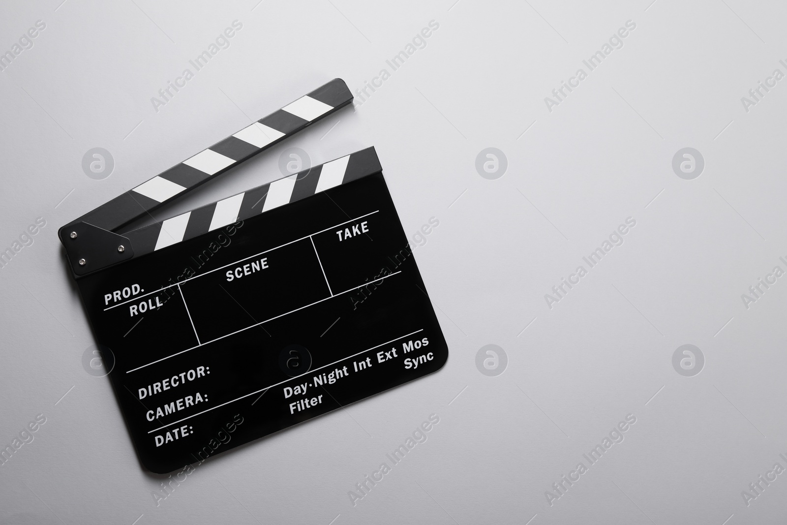 Photo of Clapperboard on gray background, top view. Space for text