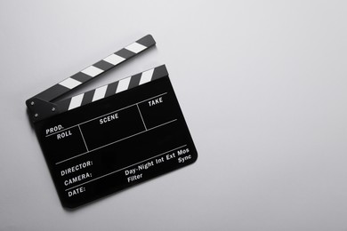 Clapperboard on gray background, top view. Space for text