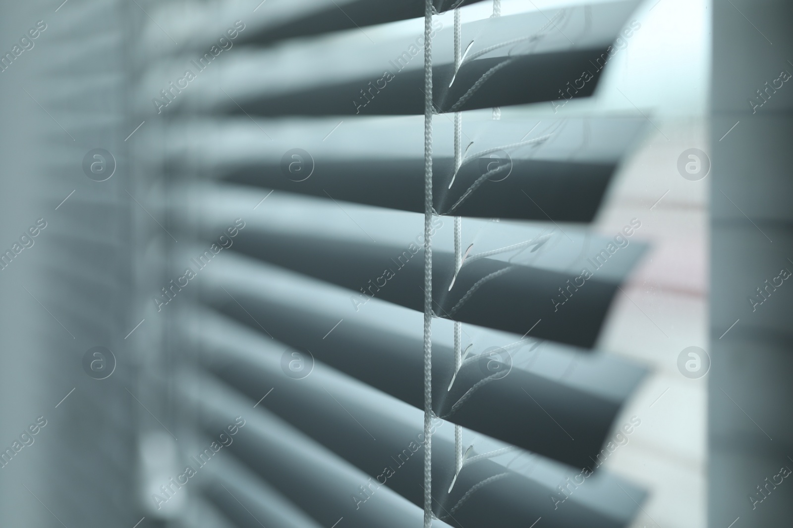 Photo of Closeup view of stylish horizontal window blinds