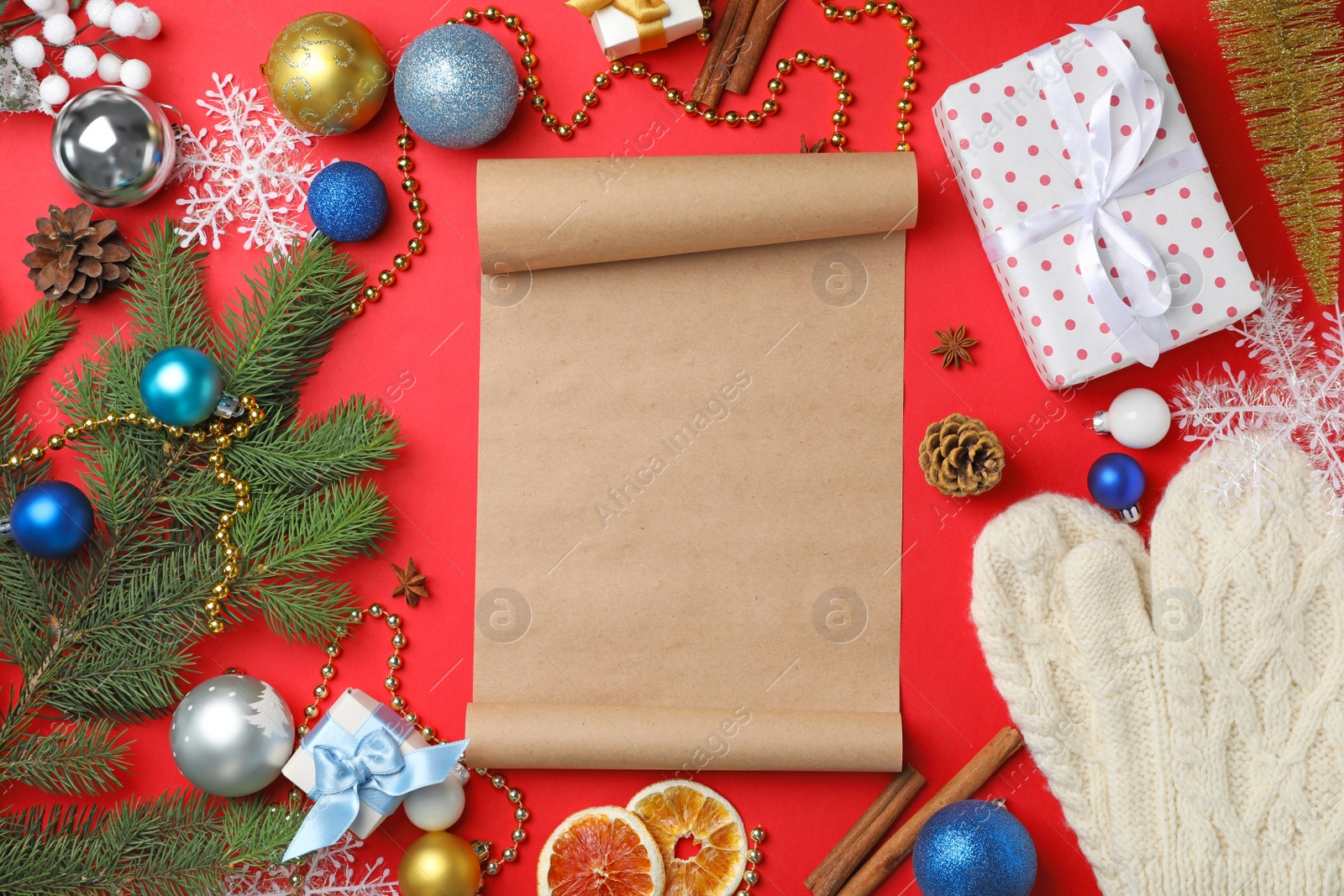Photo of Flat lay composition with scroll and Christmas decor on color background. Letter for Santa Claus