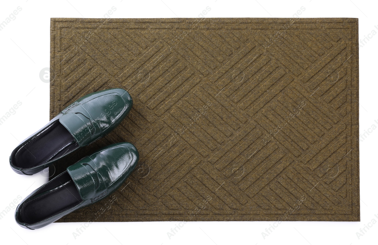 Photo of New clean door mat with shoes on white background, top view