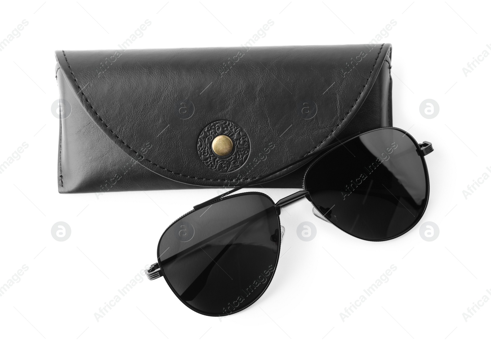 Photo of Stylish sunglasses and black leather case on white background, top view