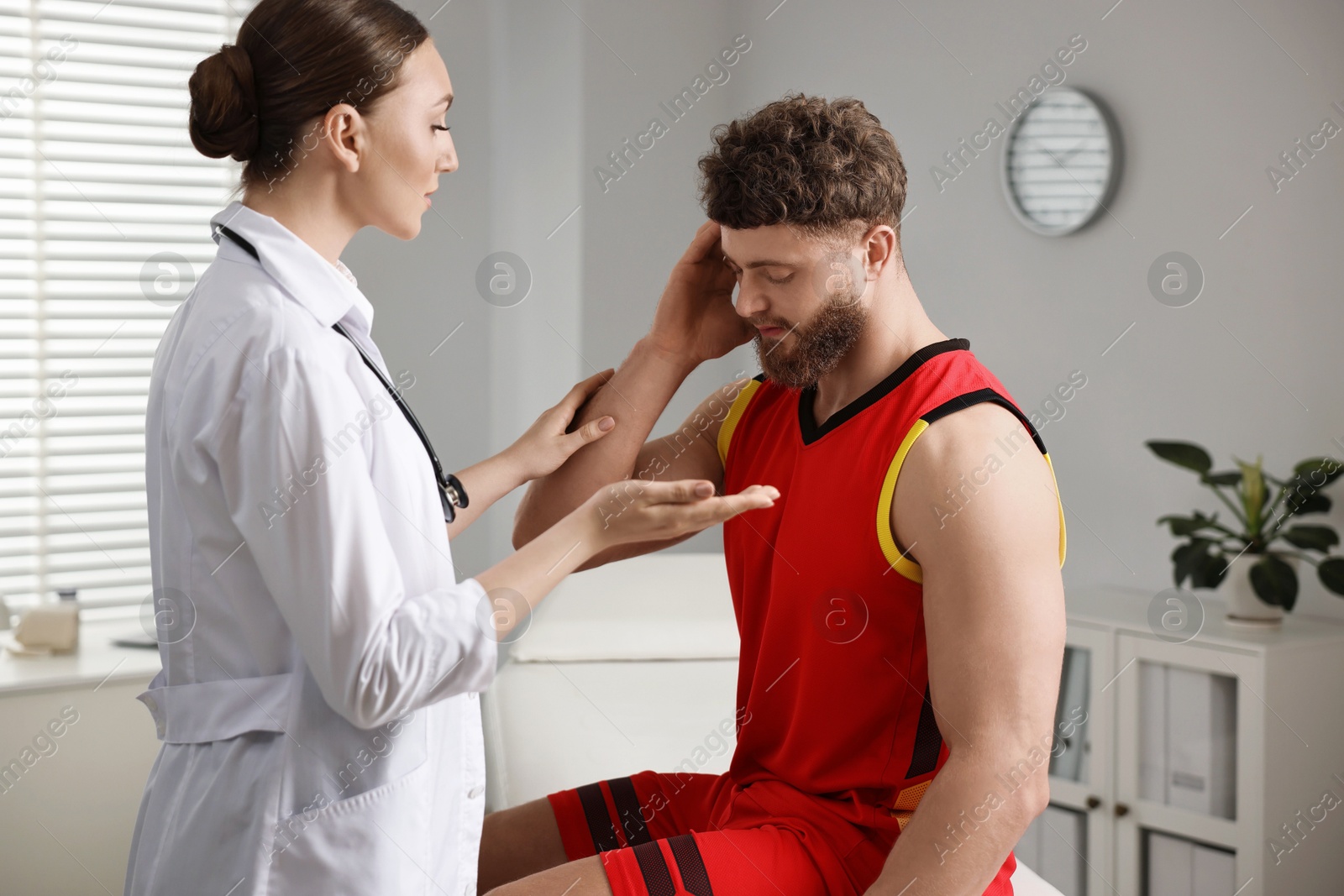 Photo of Sports injury. Doctor consulting patient in hospital