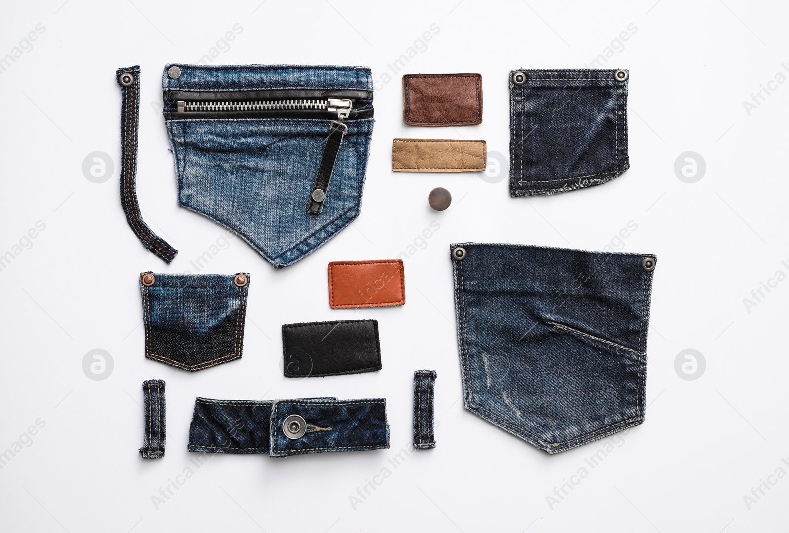 Photo of Composition with garment accessories and cutting details for jeans isolated on white, top view