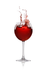 Photo of Red wine splashing in glass on white background
