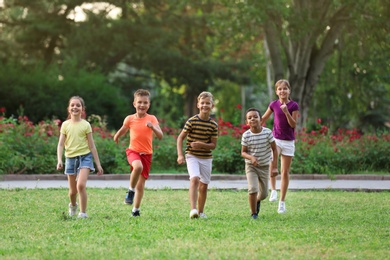 Cute smiling little children playing in park