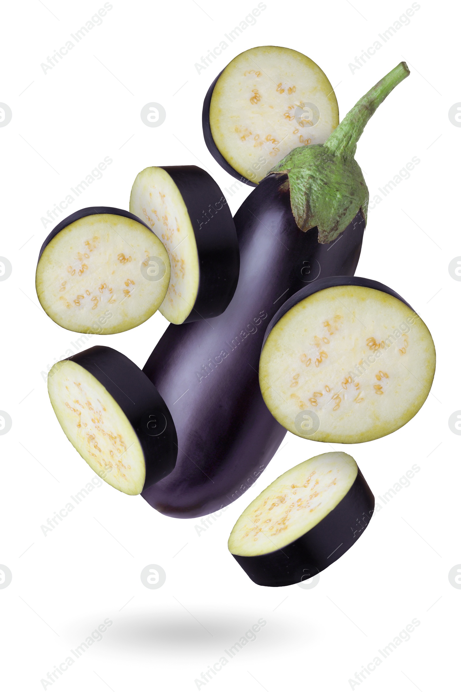 Image of Fresh eggplants falling on white background, whole and slices