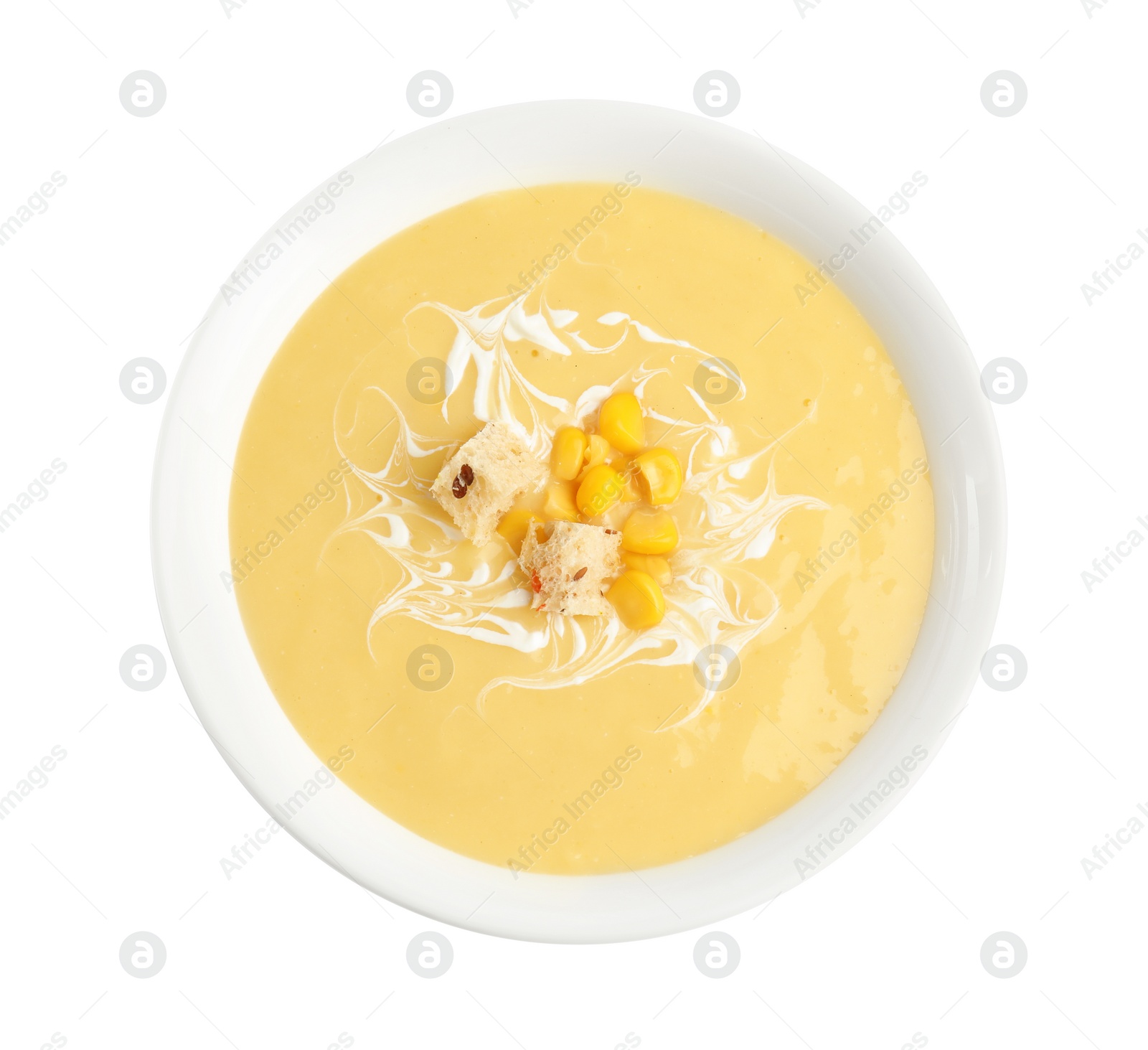 Photo of Delicious corn cream soup isolated on white, top view