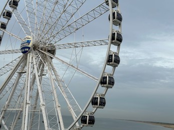 Photo of HAGUE, NETHERLANDS - OCTOBER 29, 2022: Beautiful Ferris wheel at Scheveningen beach