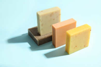 Hand made soap bars on color background