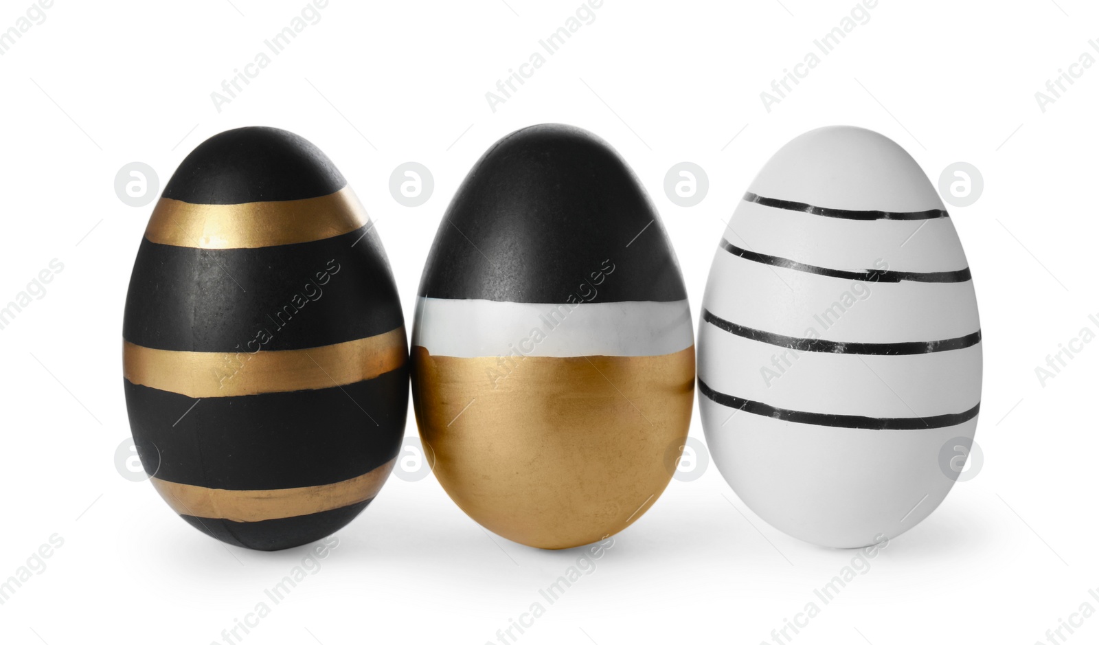 Photo of Three decorated Easter eggs isolated on white