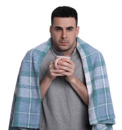 Photo of Man wrapped in blanket with cup of hot drink suffering from cold on white background