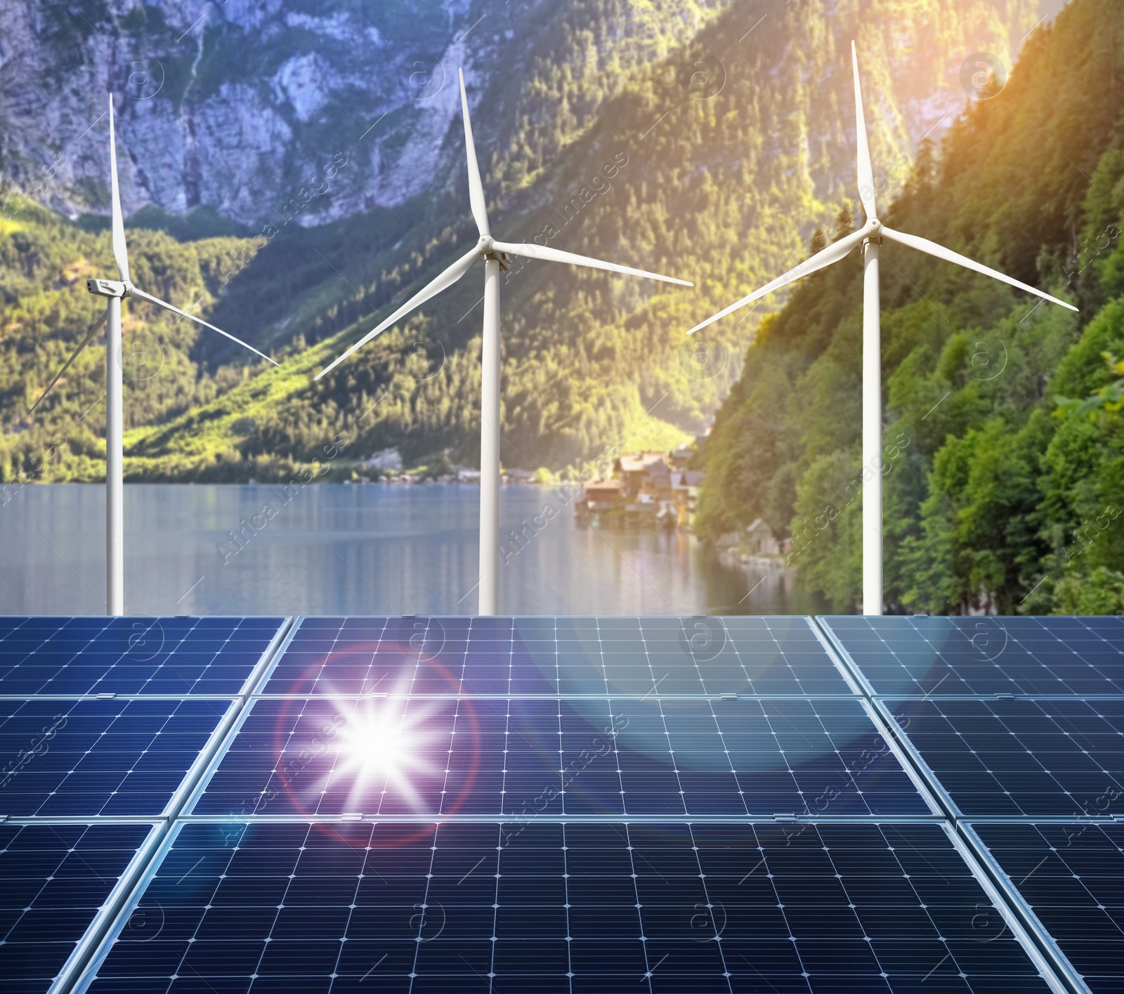 Image of Alternative energy sources. Wind turbines installed in water, solar panels on foreground