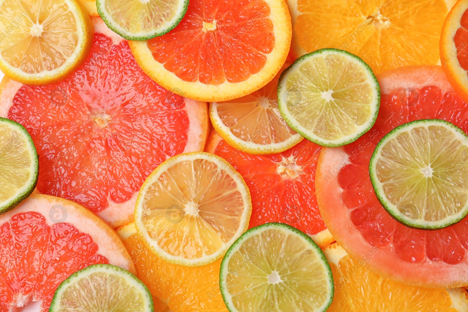 Photo of Many fresh yummy citrus slices