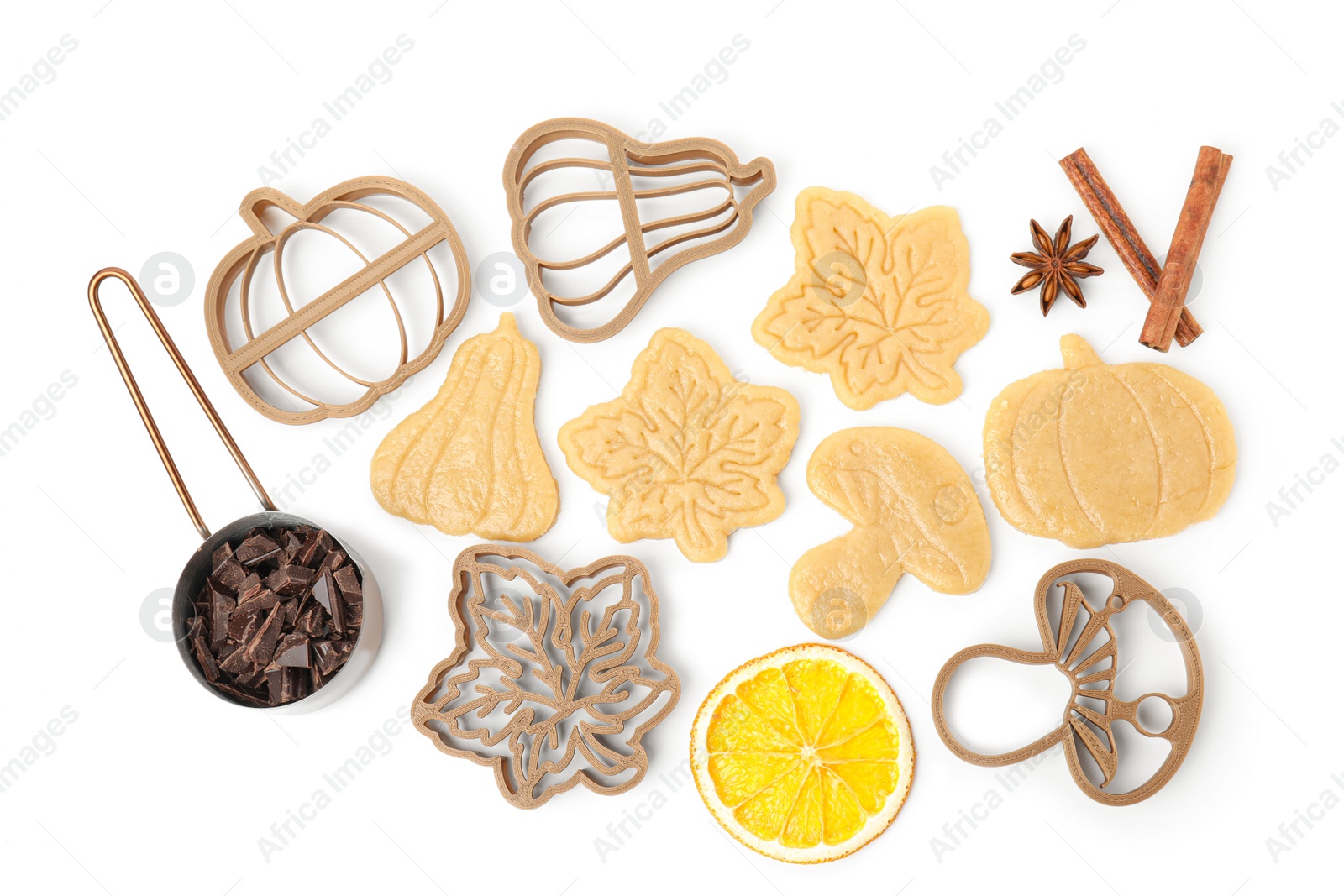 Photo of Flat lay composition with cookie cutters and unbaked biscuits on white background