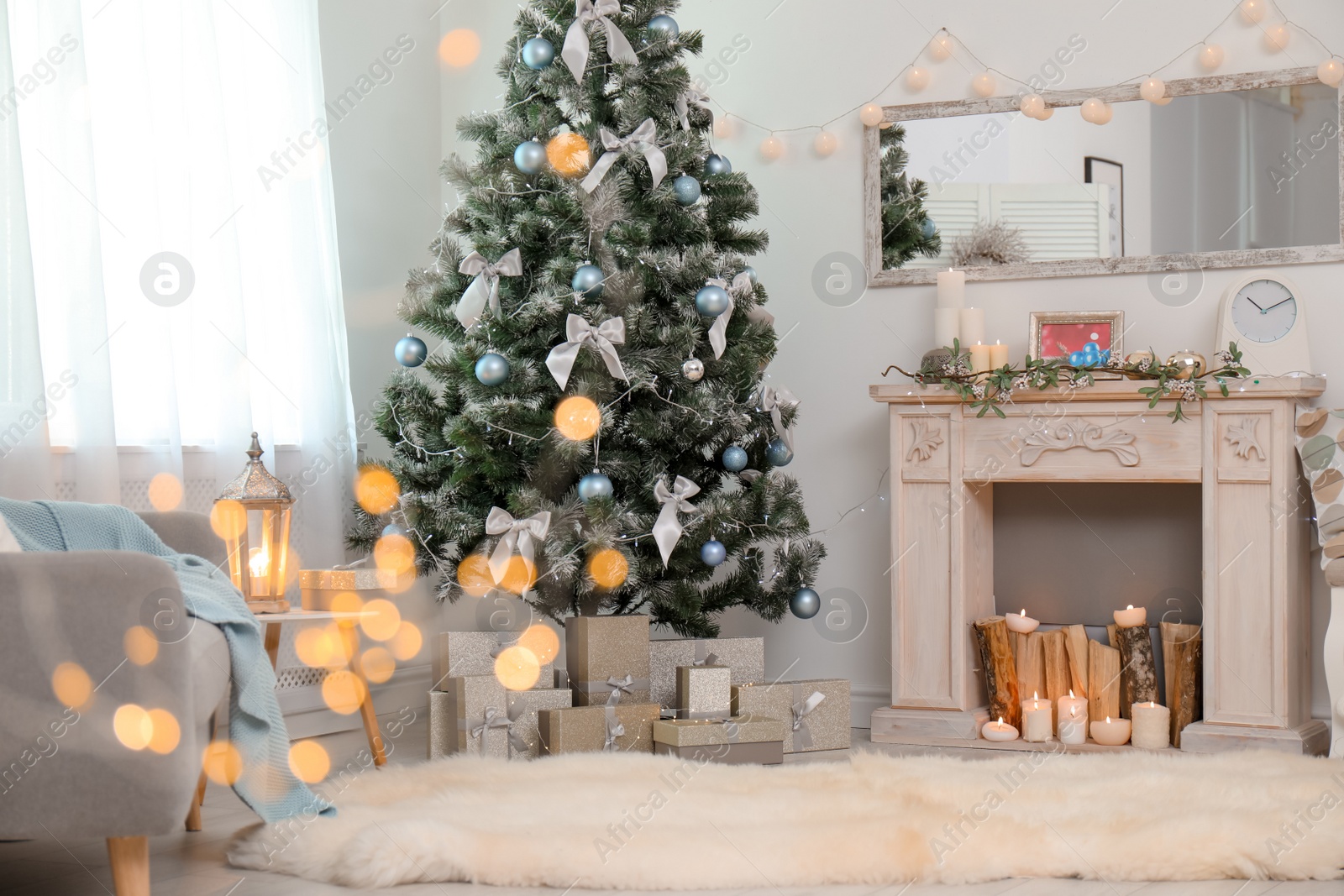 Photo of Stylish living room interior with decorated Christmas tree and blurred lights in foreground