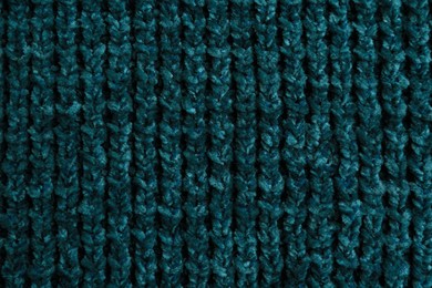 Photo of Beautiful dark knitted fabric as background, top view