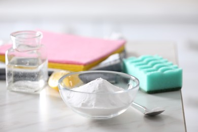 Photo of Baking soda on white marble table. Eco friendly detergent