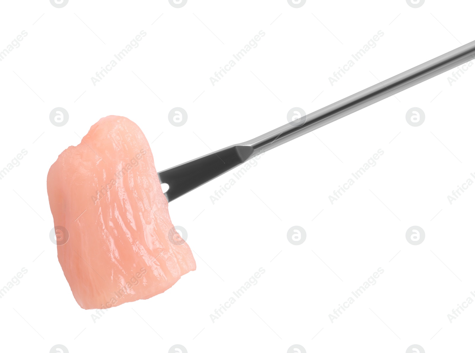 Photo of Fondue fork with piece of raw meat isolated on white, top view