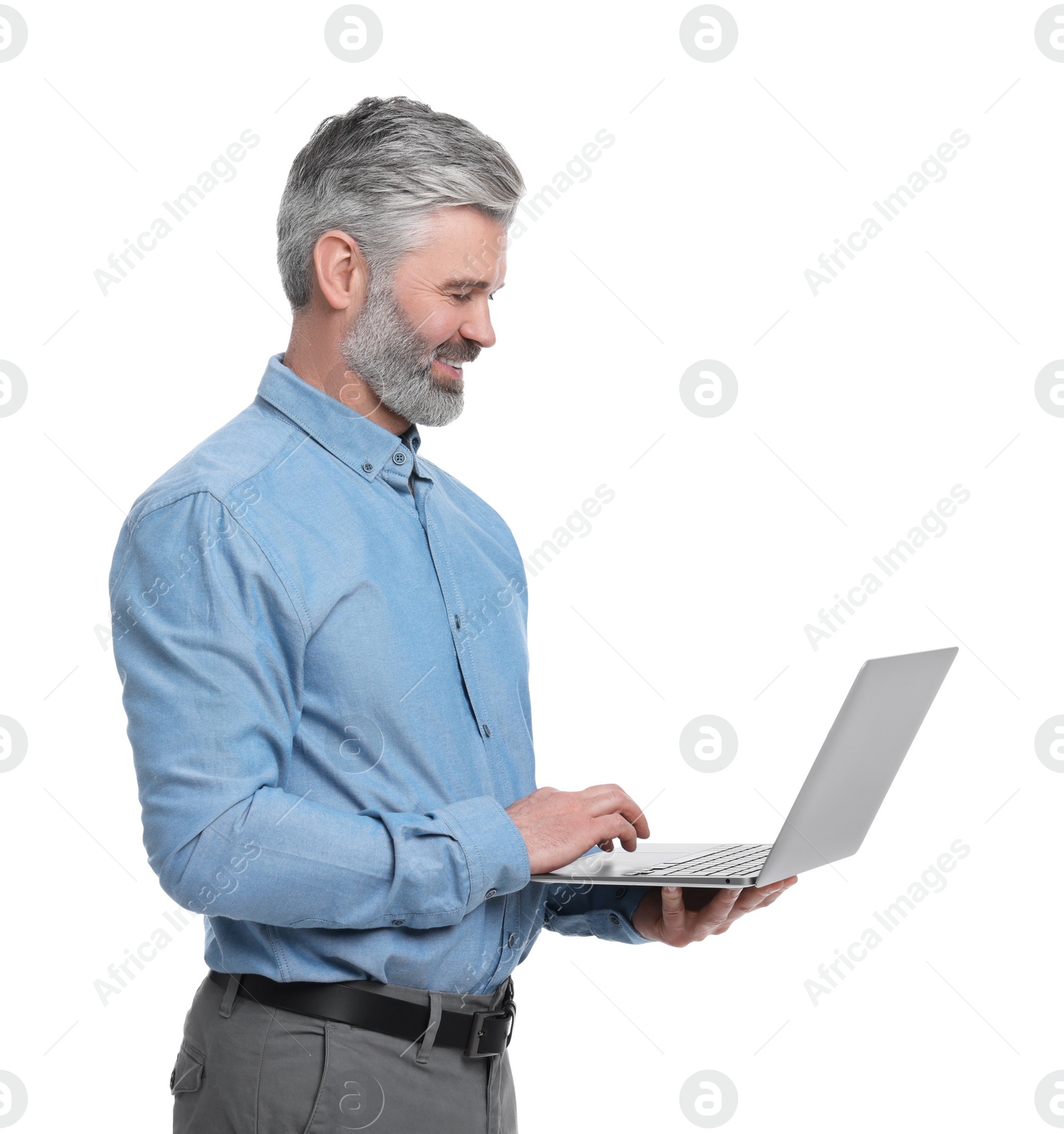 Photo of Mature businessman in stylish clothes with laptop on white background