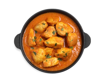 Photo of Delicious chicken curry in pan on white background, top view