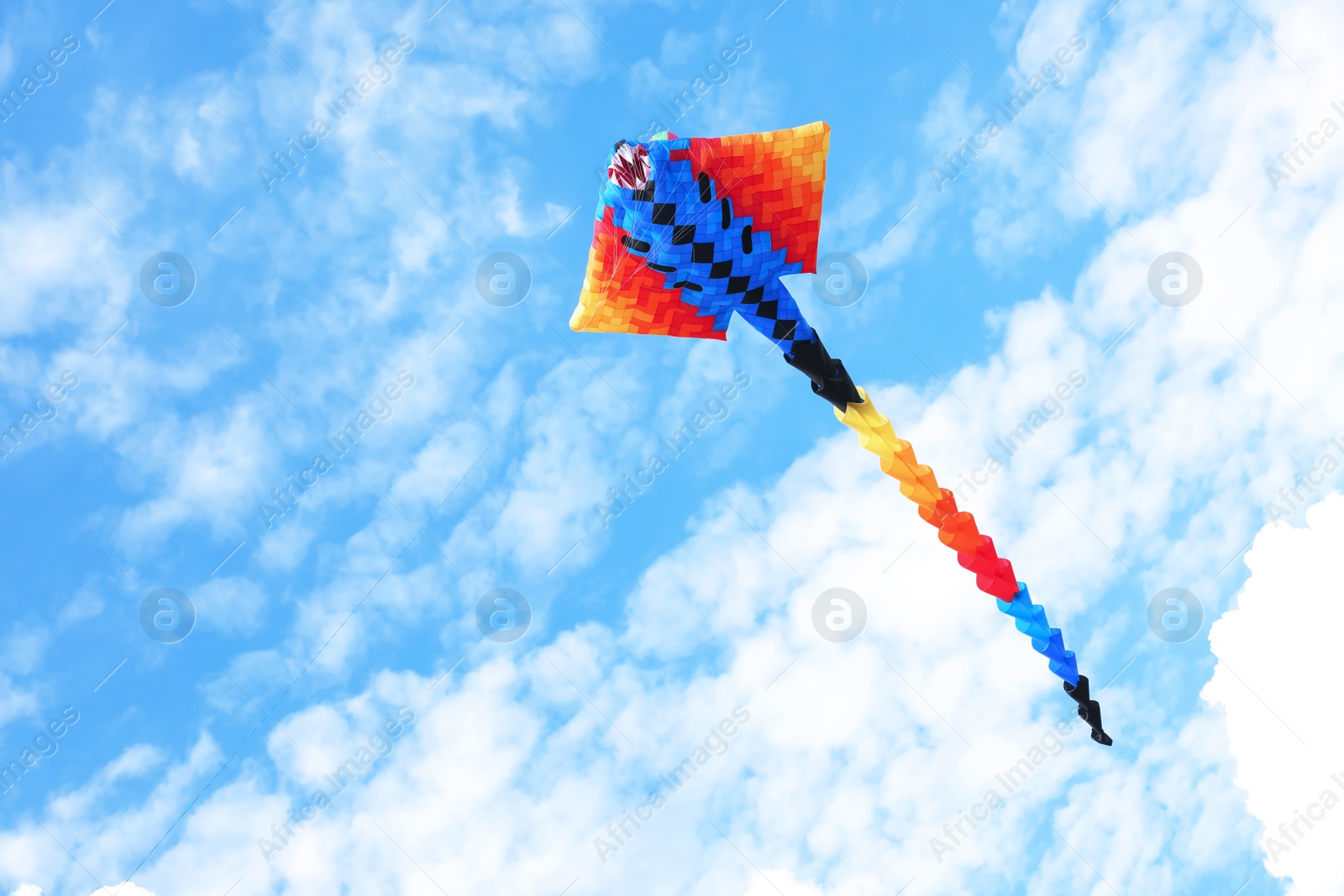 Photo of Beautiful kite drifting in blue sky