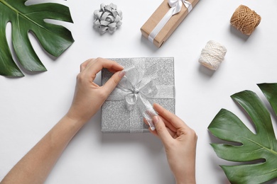 Photo of Woman with beautiful gift boxes on white background, top view