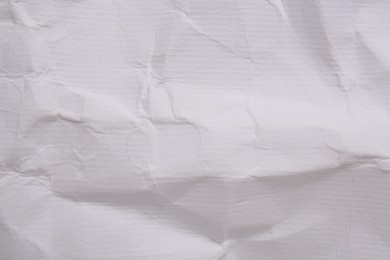 Texture of crumpled parchment paper as background, top view