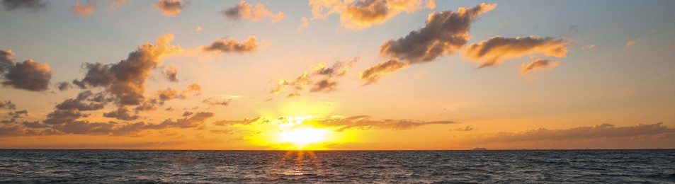 Image of Beautiful sky with sun over sea at sunset, banner design