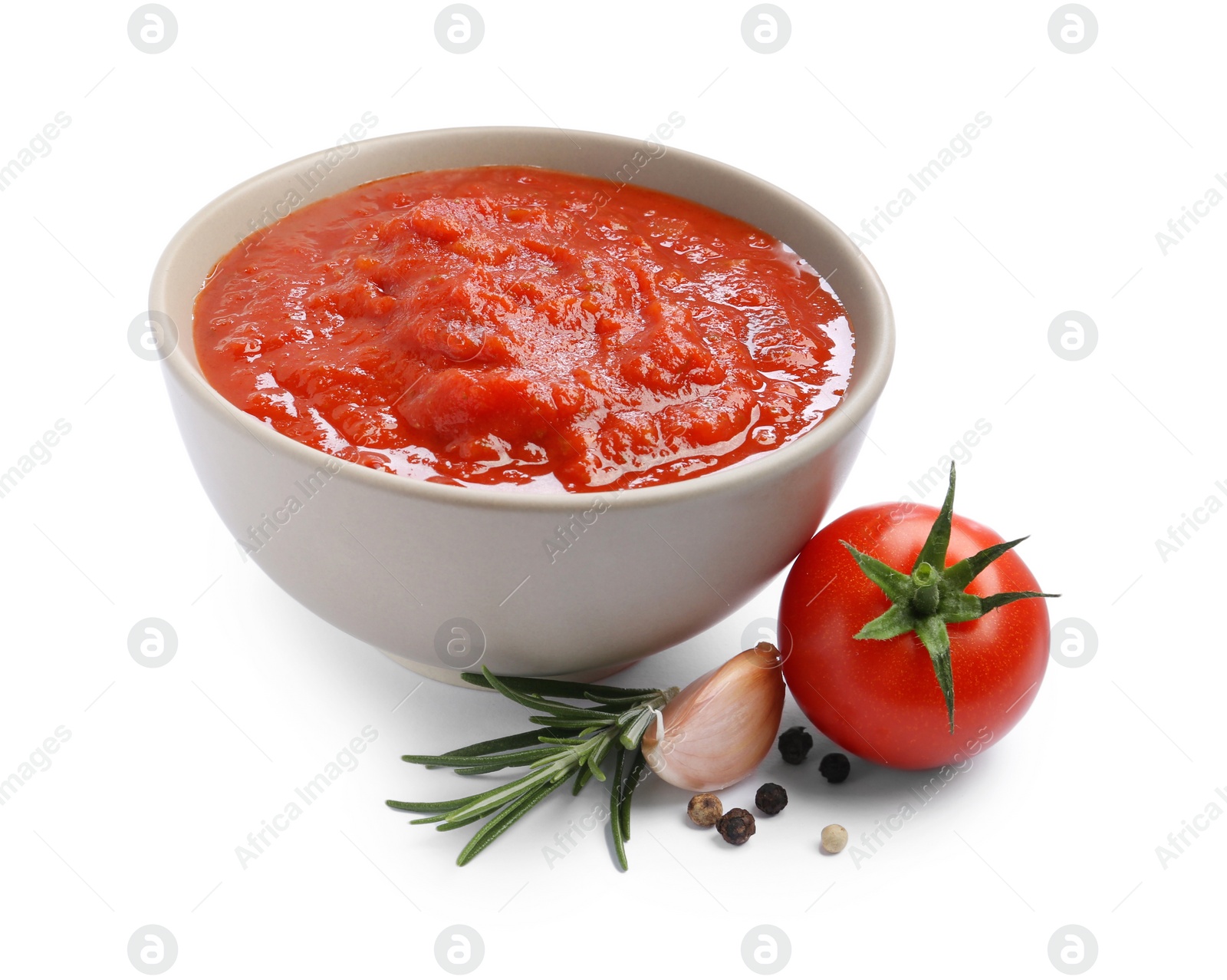 Photo of Homemade tomato sauce in bowl and fresh ingredients isolated on white