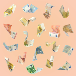 Image of Set of falling money on pale pink background. Currency exchange