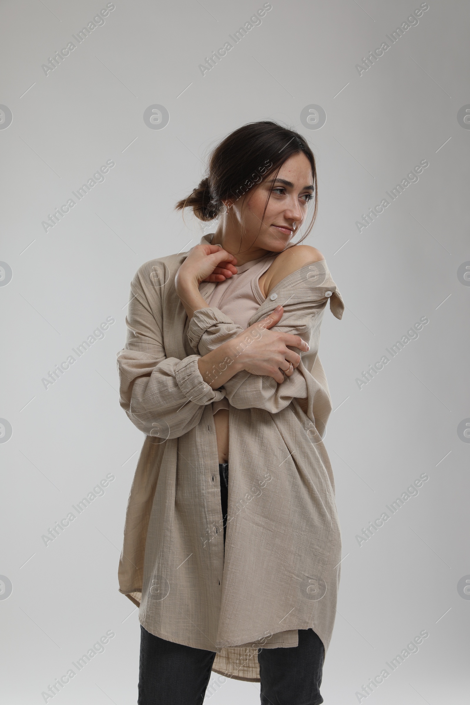 Photo of Portrait of beautiful woman on light grey background