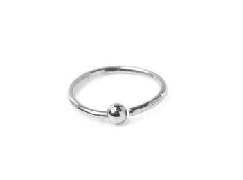 Piercing jewelry. Captive bead ring isolated on white