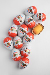 Sveti Vlas, Bulgaria - June 26, 2023: Kinder Surprise Eggs and plastic capsule with toy on white background, flat lay