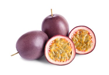 Photo of Cut and whole passion fruits on white background