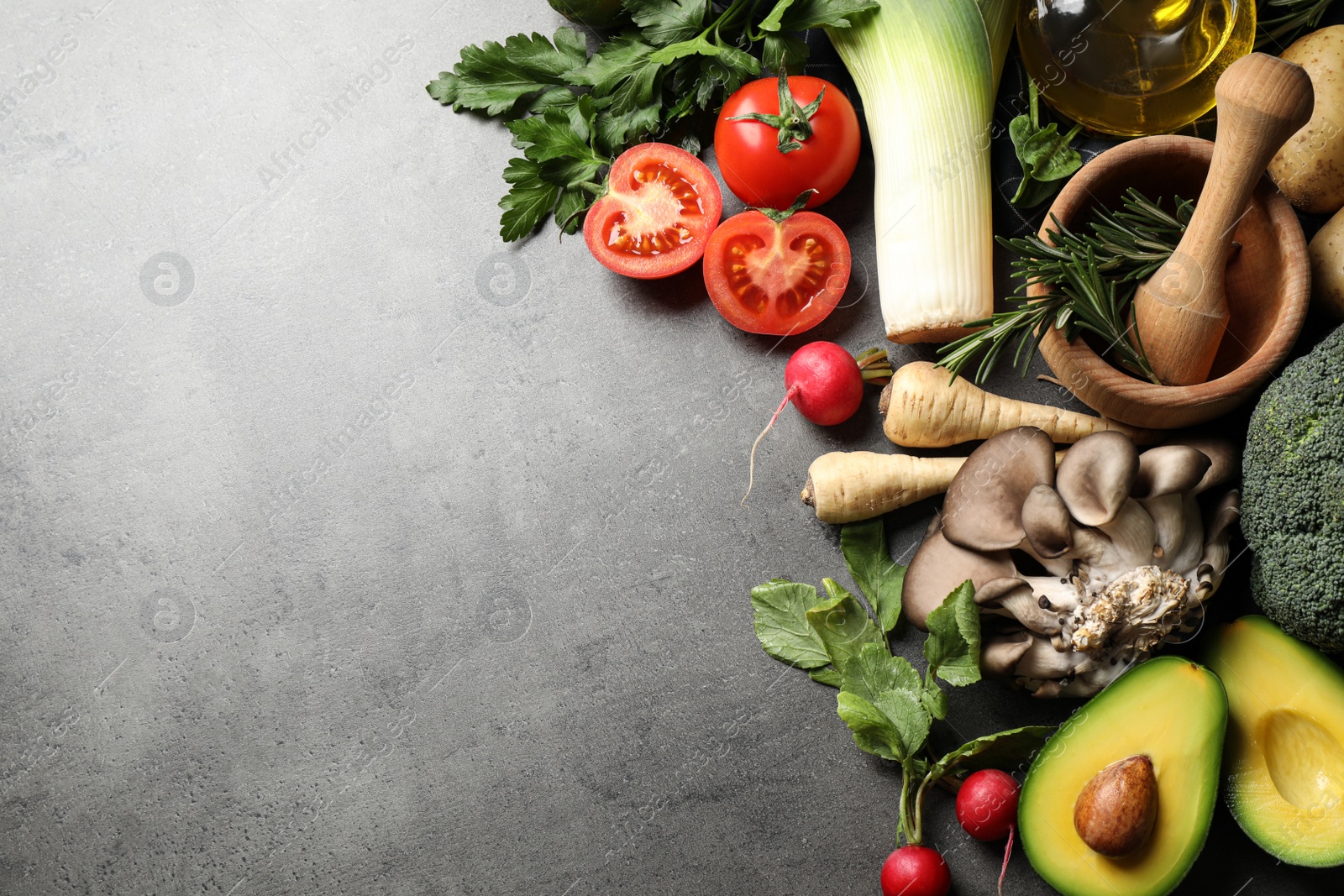 Photo of Flat lay composition with fresh products on grey table, space for text. Healthy cooking