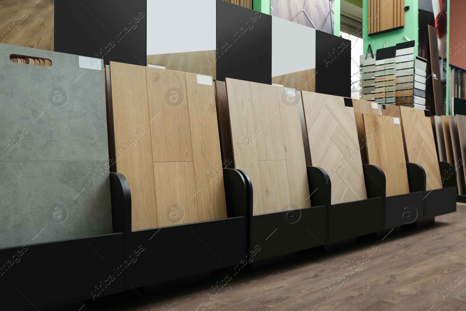 Photo of Many different samples of wooden flooring in store