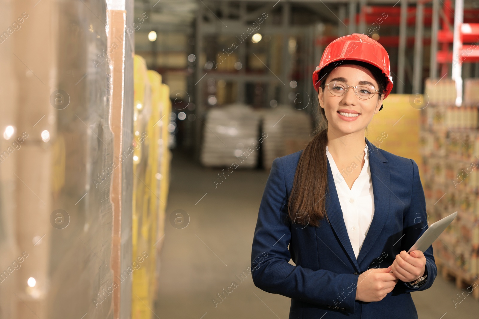 Image of Manager with tablet working at warehouse. Logistics center