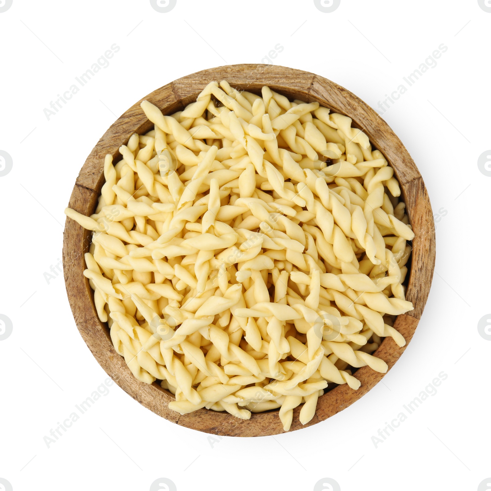 Photo of Uncooked trofie pasta in bowl isolated on white, top view