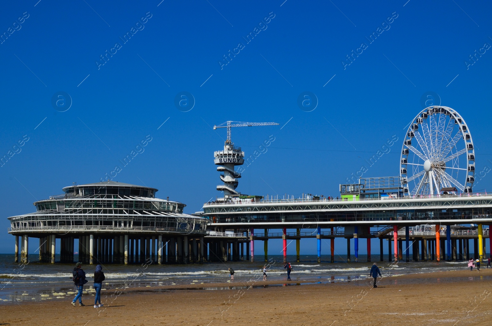 Photo of Hague, Netherlands - May 2, 2022: Beautiful view of beach and Scheveningen Pier with Ferris wheel