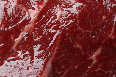 Photo of Texture of fresh beef meat as background, top view
