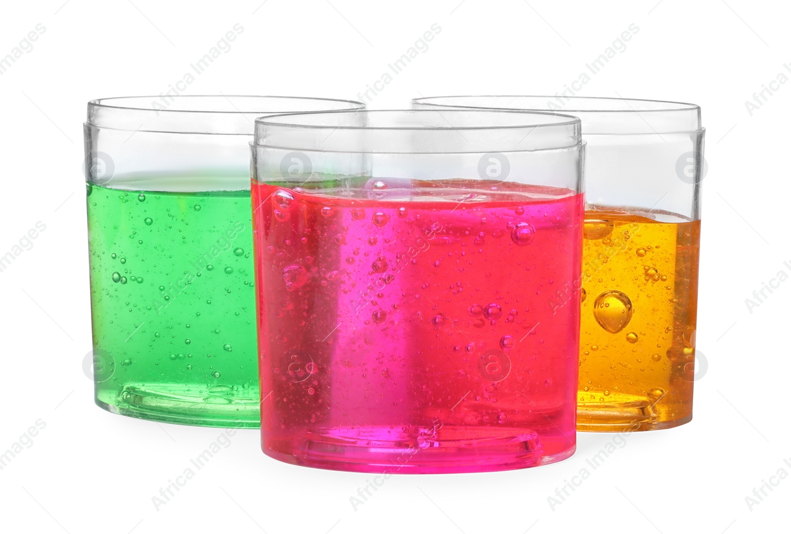 Photo of Colorful slimes in plastic containers isolated on white. Antistress toy