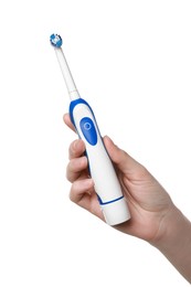 Photo of Woman holding electric toothbrush on white background, closeup