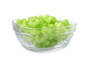 Photo of Glass bowl of fresh cut celery isolated on white