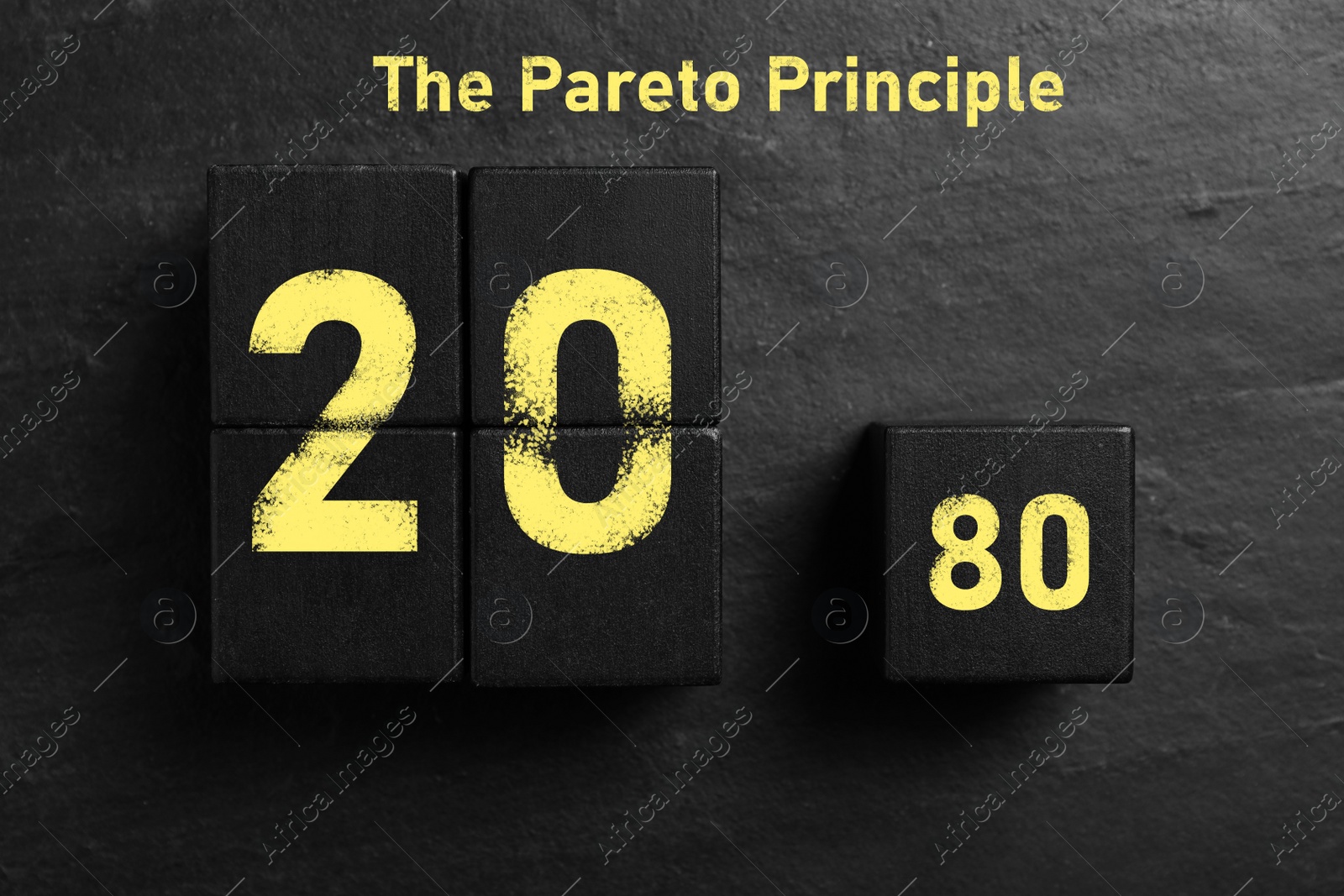 Image of Flat lay composition with cubes on black slate background. Pareto principle concept