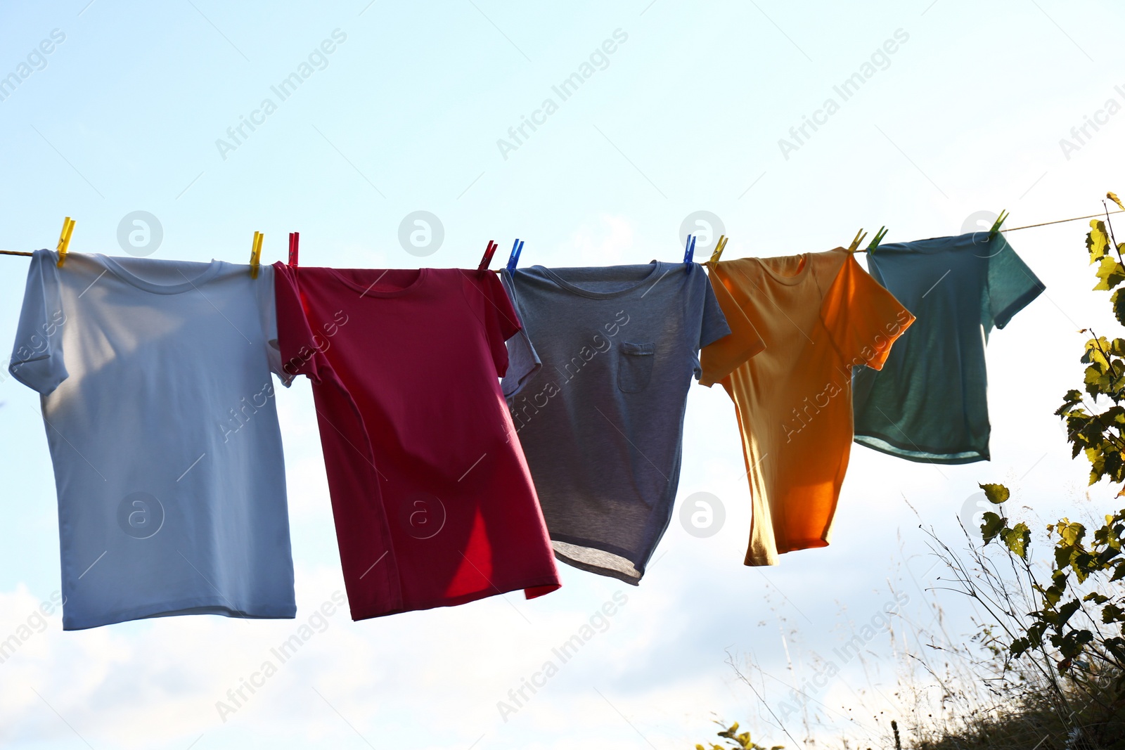 Photo of Clothes hanging on washing line against sky